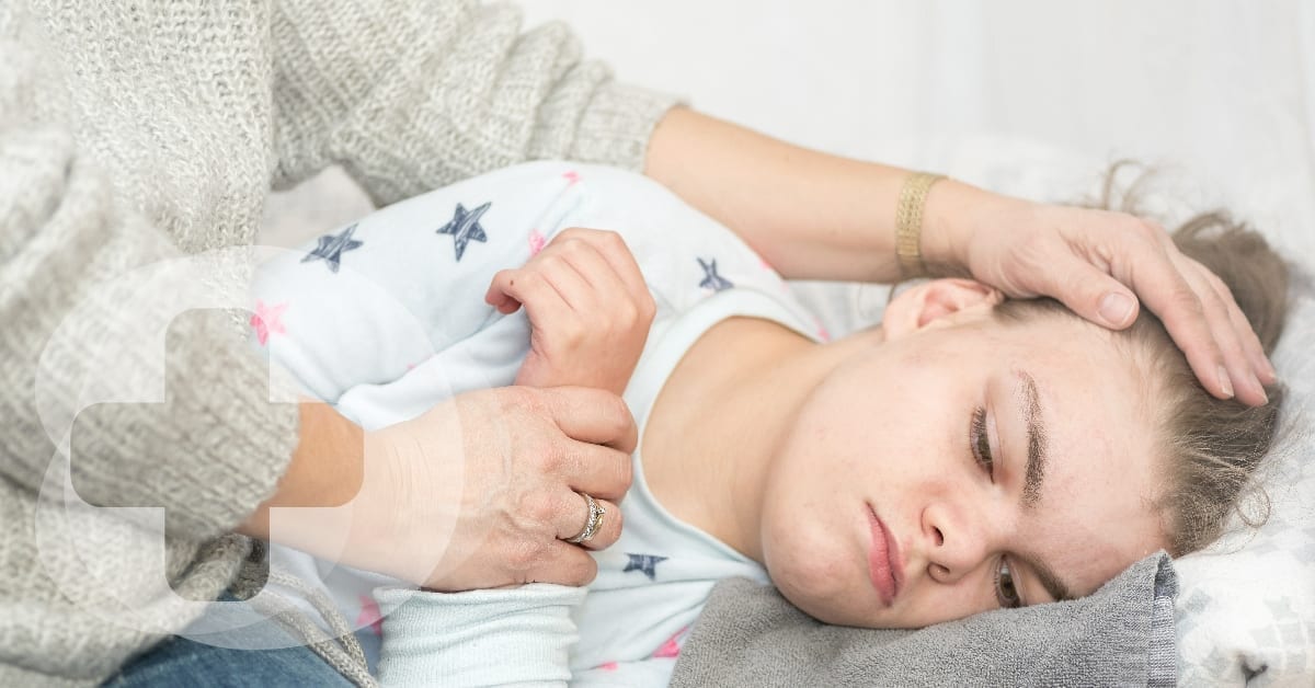 A disabled child being comforted by an older lady.