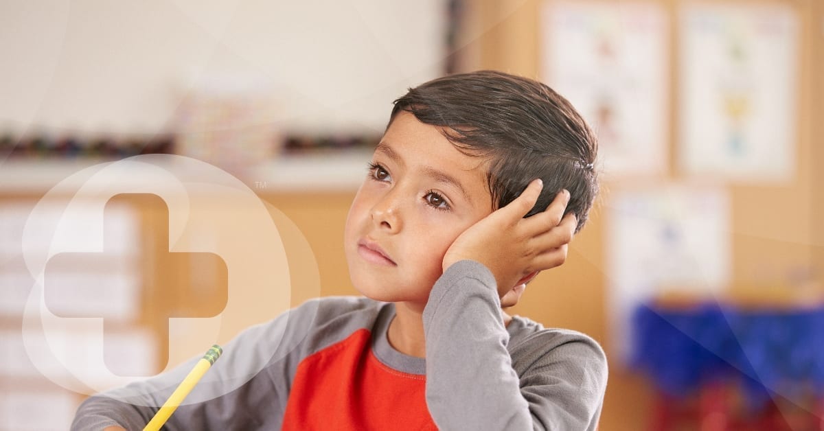 A small child staring whilst contemplating