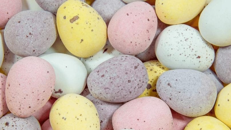 A close up shot of small chocolate covered eggs.