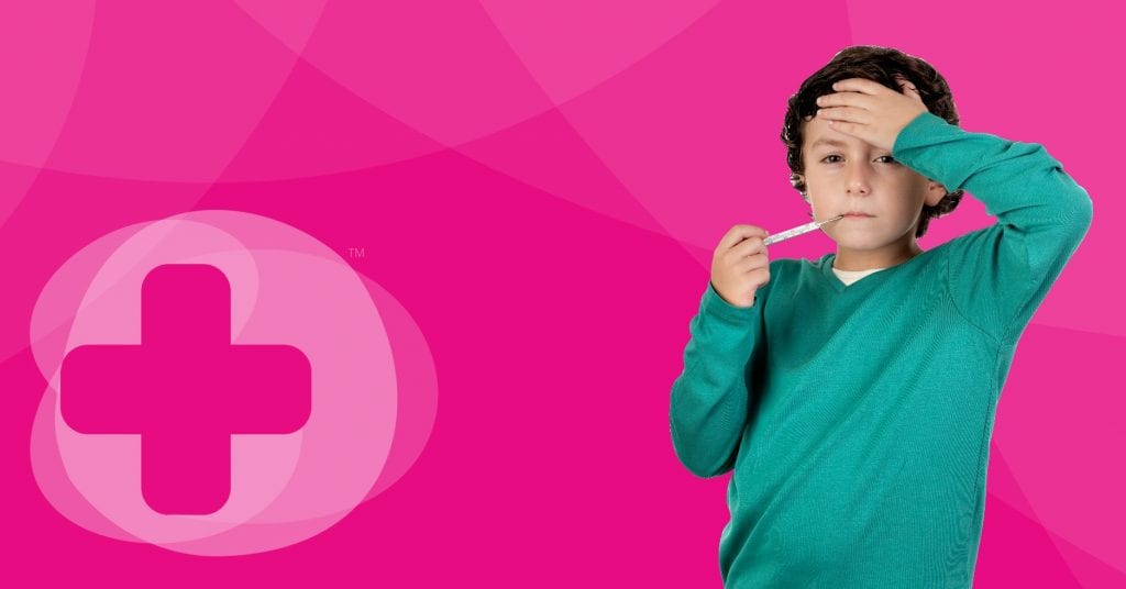 A child wearing a green sweater with a thermometer in his mouth in front of a Skillbase first aid banner