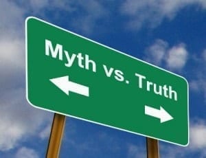 Green myth vs truth road sign with arrows pointing two different ways