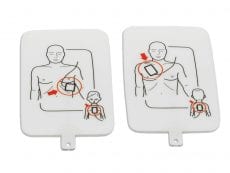 Apair of AED trainer pads with diagrams printed on them of where they should be placed.