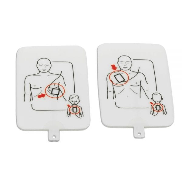 Apair of AED trainer pads with diagrams printed on them of where they should be placed.