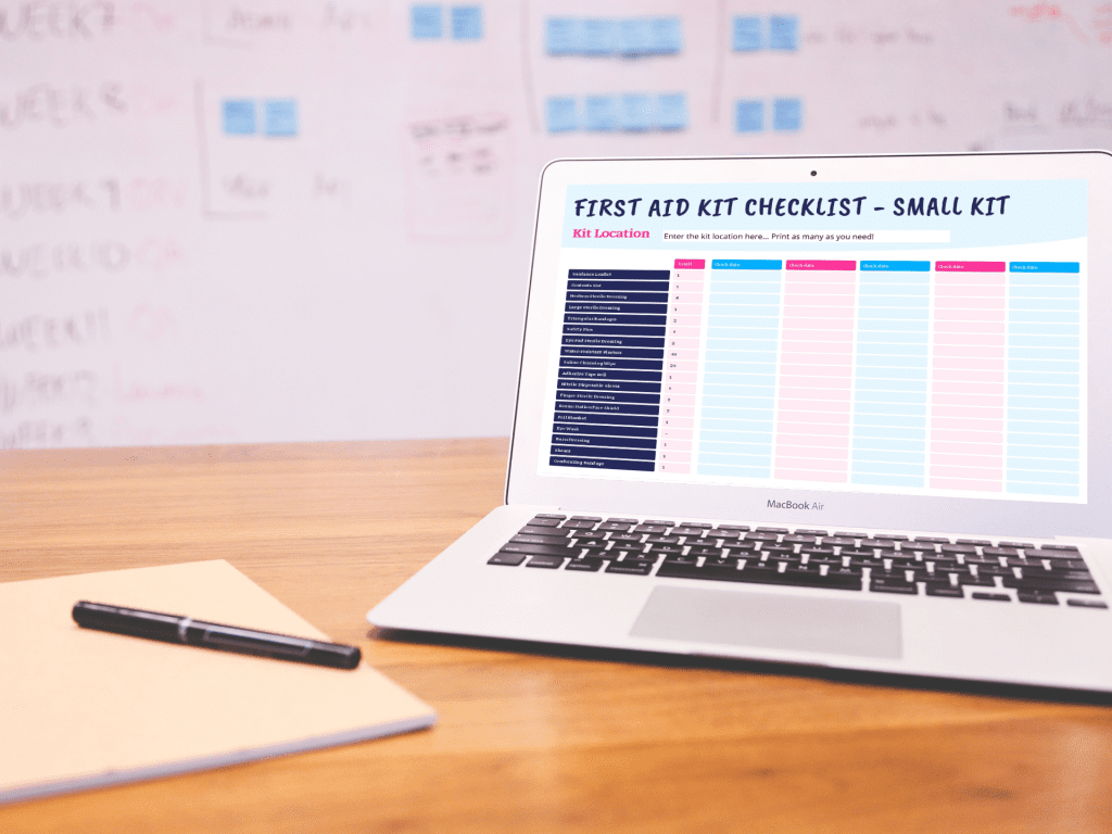 a laptop open on a table with a first aid kit checklist on the sceen.
